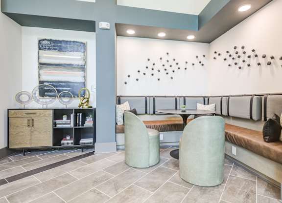 a seating area with two chairs and a tableat Century University City, Charlotte, 28213