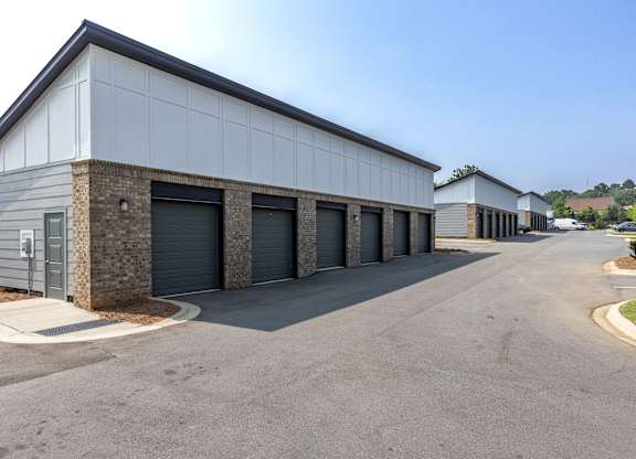 a row of garages with garages on each side of the building at Century University City, North Carolina