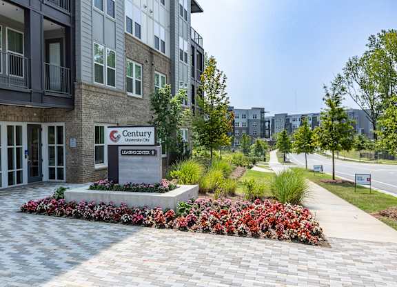 a building entrance with a sign that says canterburyat Century University City, North Carolina, 28213