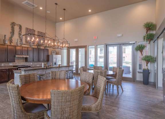 a dining room and kitchen with a table and chairs at Century Palm Bluff, Portland, 78374