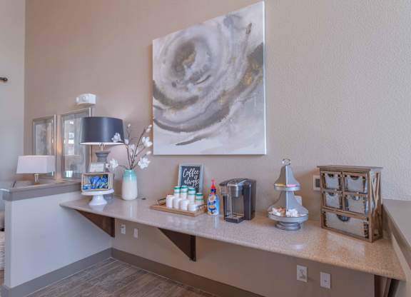 a living room with a desk and a painting on the wall at Century Palm Bluff, Portland, Texas