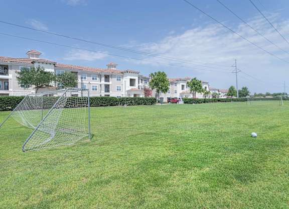 a soccer field at the whispering winds apartments in pearland, tx at Century South Shore, League City