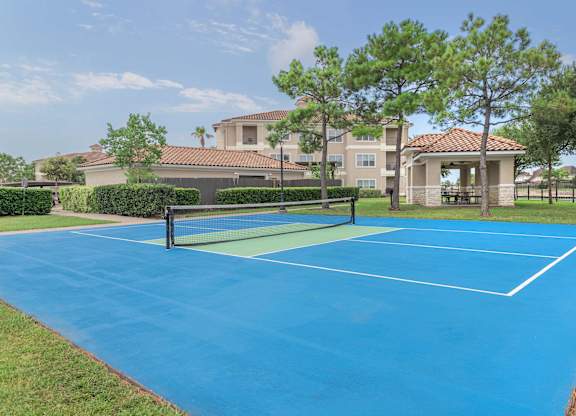 tennis court at the whispering winds apartments in pearland, tx at Century South Shore Apartments, League City, 77573
