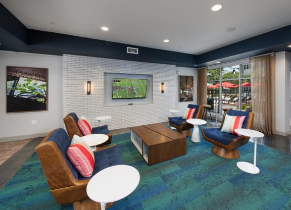 a resident clubhouse with a tv and seating area at Marley EAV, Atlanta, GA, 30316