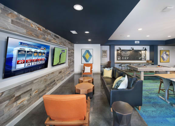 a recreation room with a shuffleboard table and couches at Marley EAV, Atlanta, GA, 30316