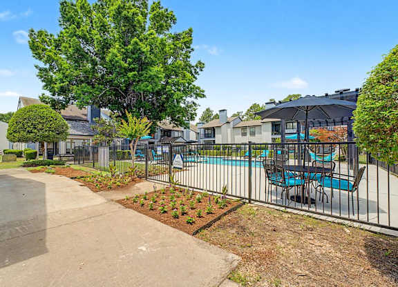 A residential area with a pool and a fence.
