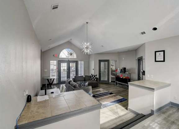the living room and kitchen of a new home at The Sapphire, Georgia, 30035