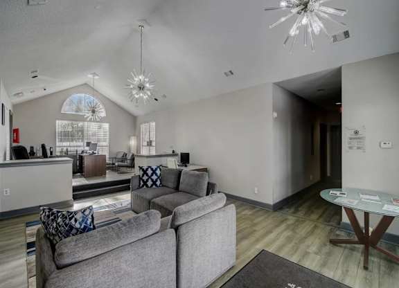 a living room with a couch and a table at The Sapphire, Decatur, GA