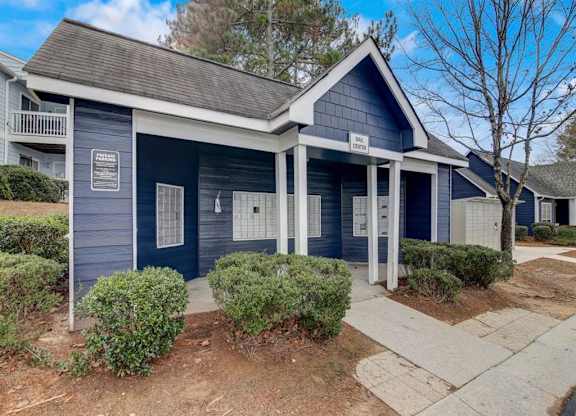 a blue and white house with a sidewalk in front of it at The Sapphire, Decatur, 30035