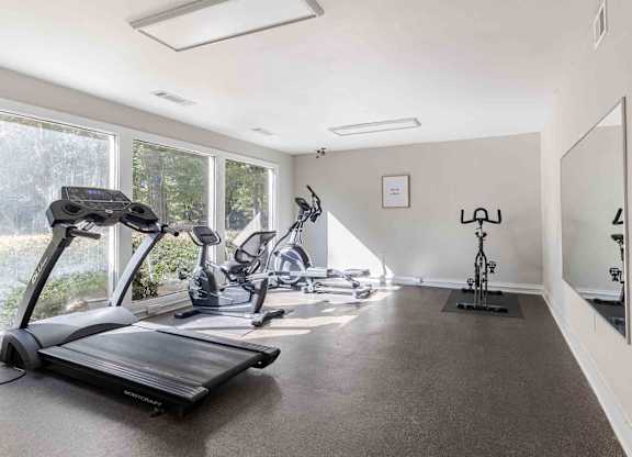 A spacious room with exercise equipment and a large window. at Grove at St. Andrews, Columbia, SC