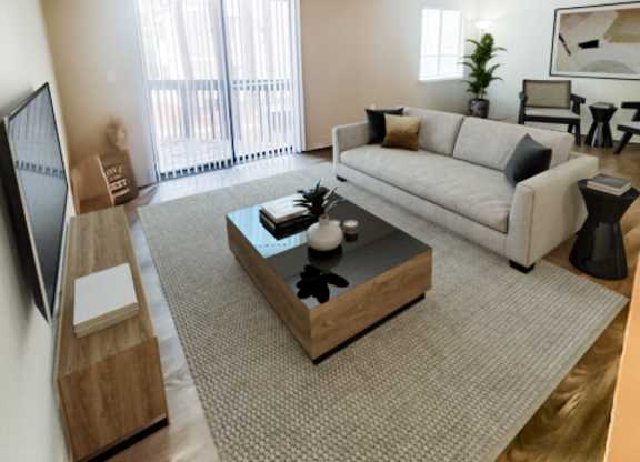 an aerial view of a living room with a couch and a coffee table