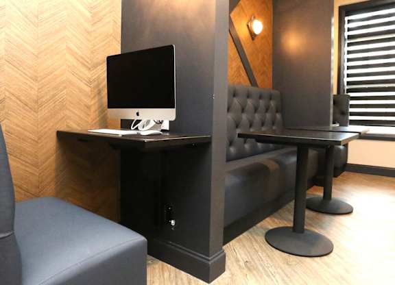 a desk with a computer and a chair in a room at Century Baxter Avenue, Kentucky, 40204