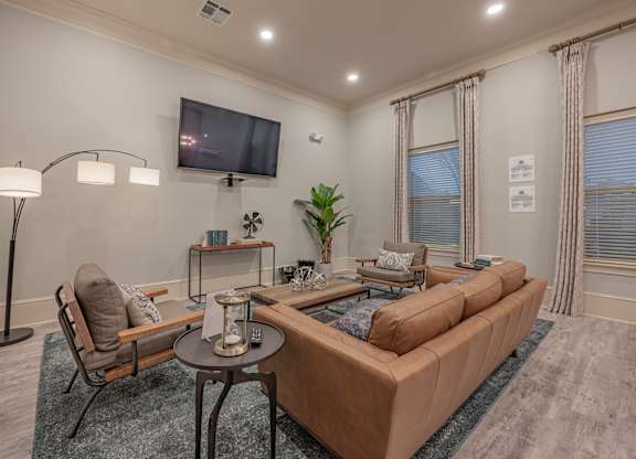 a living room with couches and a tv at Century HomePlace, Alabama, 36066
