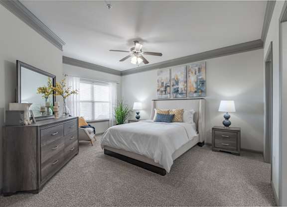 a bedroom with a bed and a ceiling fan at Century HomePlace, Prattville Alabama