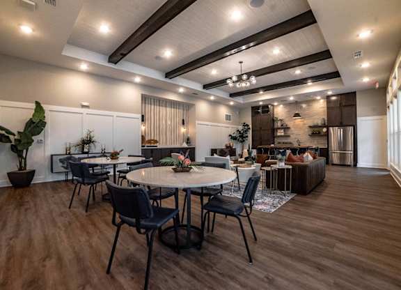 a dining room and living room with tables and chairs