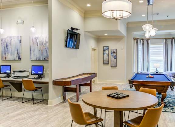 a game room with a pool table and a tv at Century HomePlace, Prattville