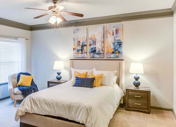 a bedroom with a bed and a ceiling fan at Century HomePlace, Prattville, AL