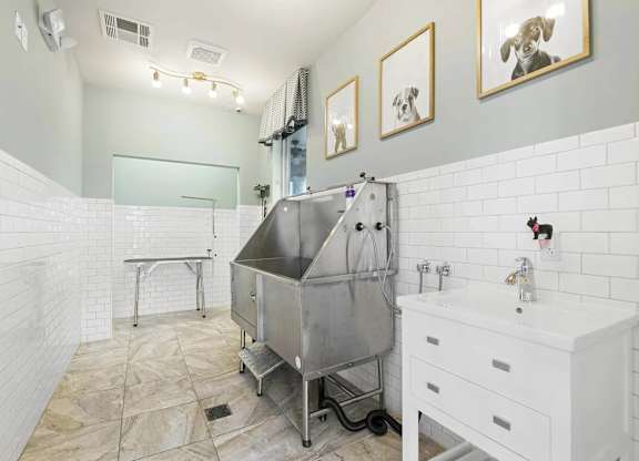 a white bathroom with a stainless steel tub in the middle at Century HomePlace, Alabama, 36066
