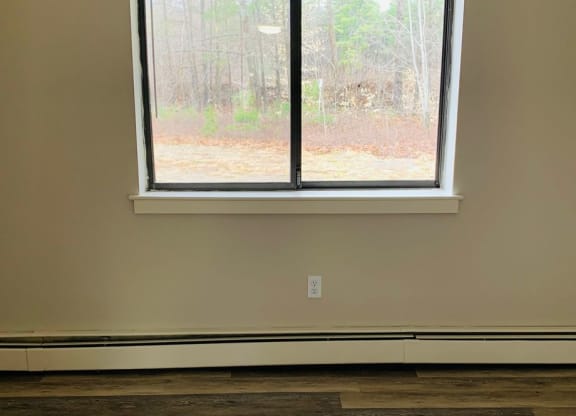 a large window in a room with a wood floor at Briarcliff at Quechee, Quechee Vermont