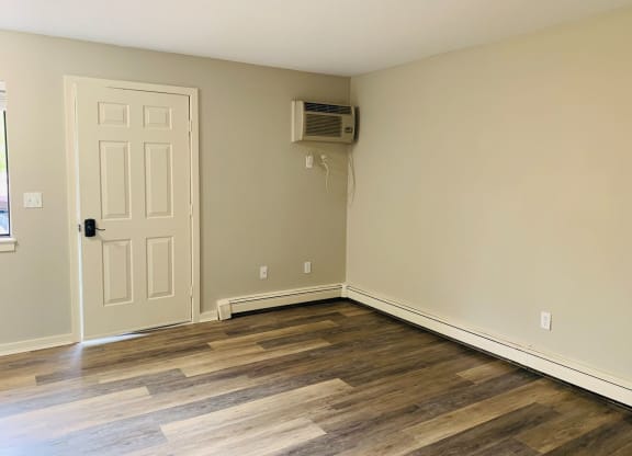 a empty room with a door and a air conditioner at Briarcliff at Quechee, Quechee Vermont