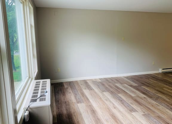 an empty room with wood floors and a window at Briarcliff at Quechee, Quechee Vermont