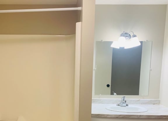 a bathroom with a sink and a bath tub at Briarcliff at Quechee, Quechee, 05059