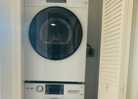 a washing machine and a washer and dryer in a closet at Briarcliff at Quechee, Vermont