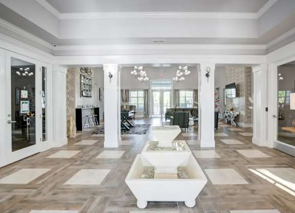 A spacious living room with a white coffee table in the center.at Century Ariva, Lakeland