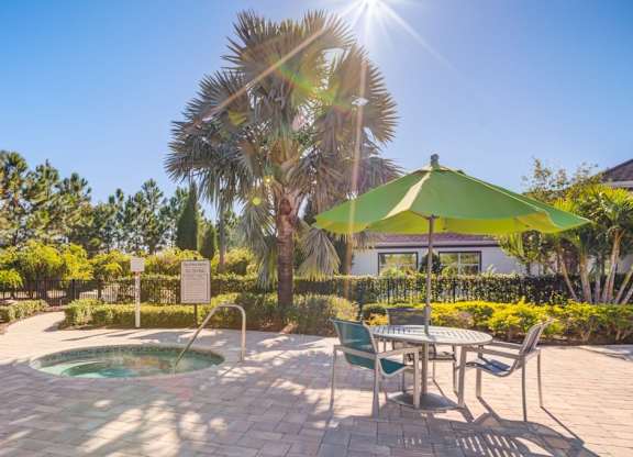 A sunny day at the outdoor seating area with a pool.at Century Ariva, Lakeland