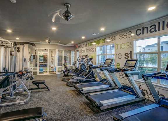 A gym with treadmills, weights, and exercise equipment.at Century Ariva, Lakeland