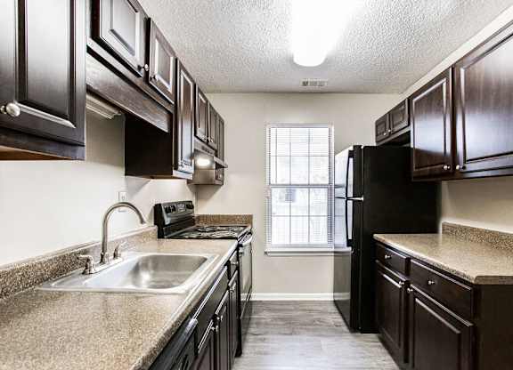Black Appliances in Kitchen at Wildcreek Apartments, Clarkston, GA 30021