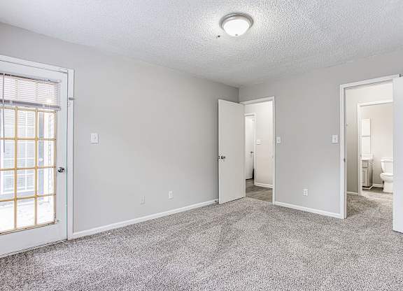 Carpeted Living Area at Wildcreek Apartments, Georgia 30021