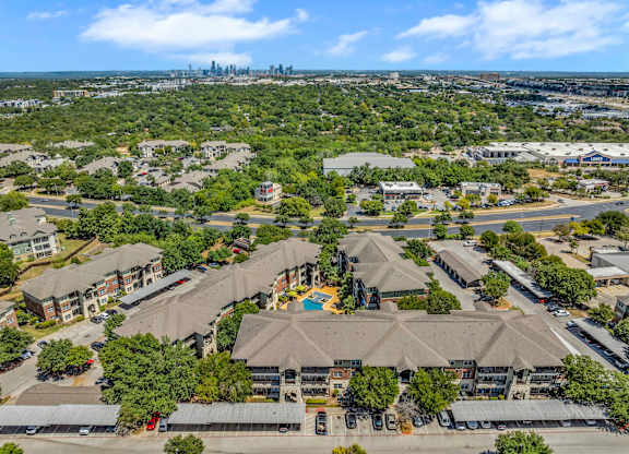 A bird's eye view of a residential area with houses and apartment buildings.