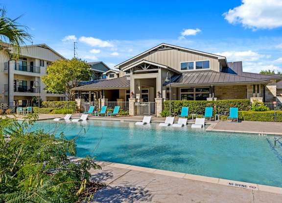 Pool With Relaxing Chairs at Bridge at Southpark Meadows, Texas