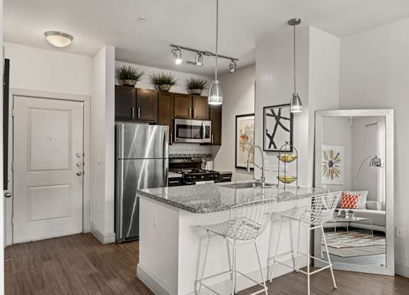 A kitchen with a whi at The James on South First, Austin, TX