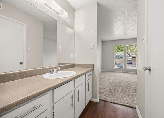 A bathroom with a sink and mirror. at Montecito, Austin, Texas