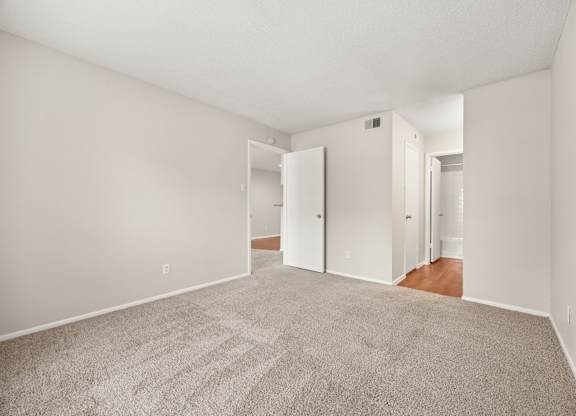 A room with a carpeted floor and white walls. at Montecito, Austin, TX, 78741