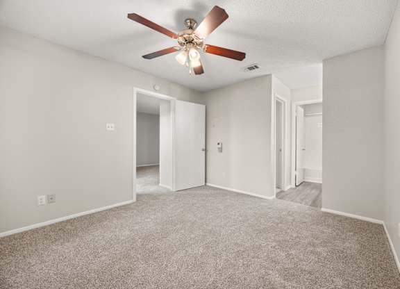 A room with a ceiling fan and carpeted floor. at Montecito, Texas, 78741