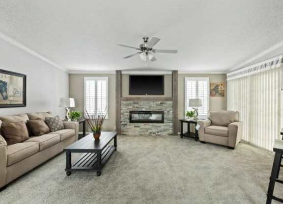 a living room filled with furniture and a fireplace