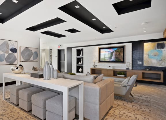a living room with a table and chairs and a television