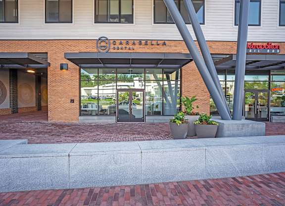 The image shows a building with a sign that reads