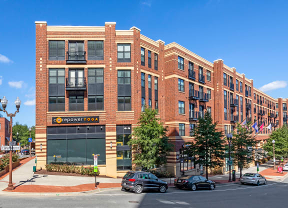 Image showing urban charm with a bold presence. 19Nineteen anchors Clarendon with timeless brickwork, street-level energy, and undeniable curb appeal.