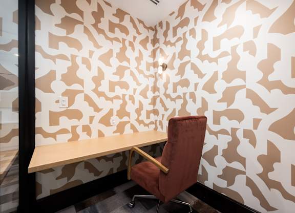 Image showing a quiet nook to power through. Soft seating meets geometric flair in this private productivity zone