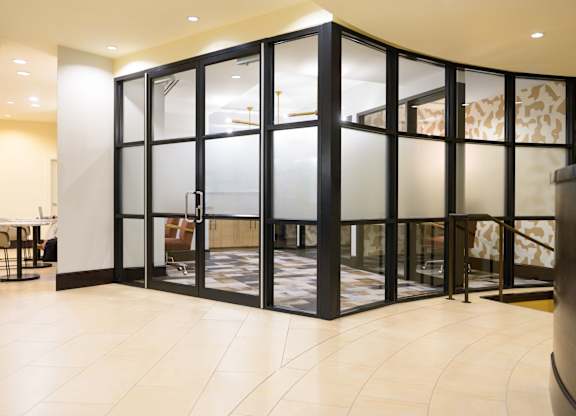 Image showing glass-encased style. A sleek coworking space that’s as polished as it is productive.