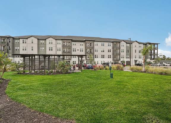Large grass courtyard for pets at The Crossing