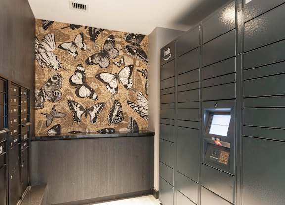 A wall with butterflies on it is behind a counter.