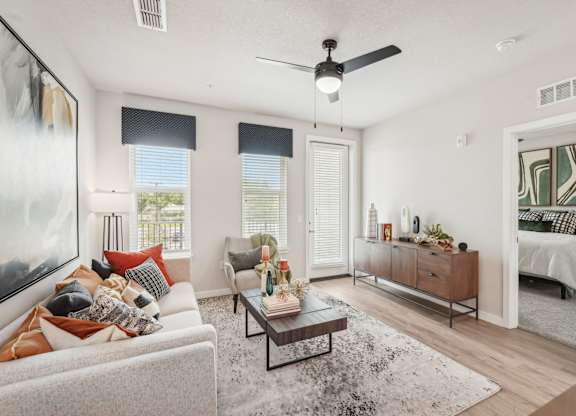 Furnished living room in two bedroom apartment model