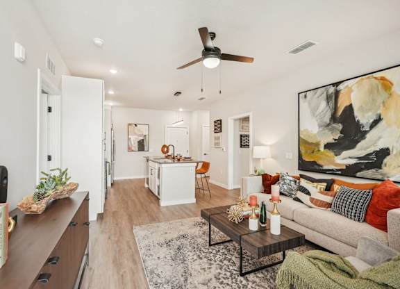 Furnished living room in one bedroom apartment model