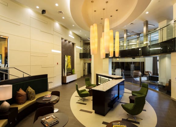 Lobby of Citron with white lights and green chairs.