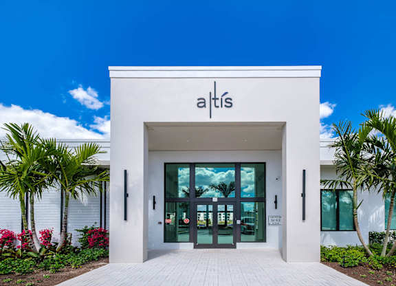 The front of a white building with the name